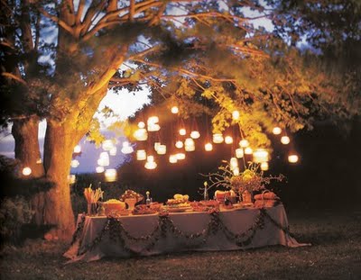 Evening wedding with Mason jar lanterns lighting the buffet
